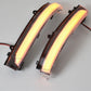 Two curved LED lights with visible wiring on a gray background